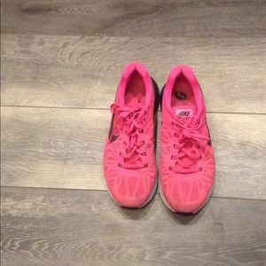 Pink nike women's sneakers a little worn.